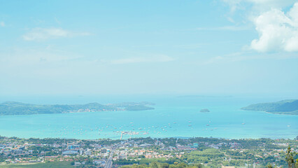 Phuket Big Buddha statue. afternoon light sky and blue ocean are on the back of white Phuket big Buddha is the one of landmarks on Phuket island Thailand.