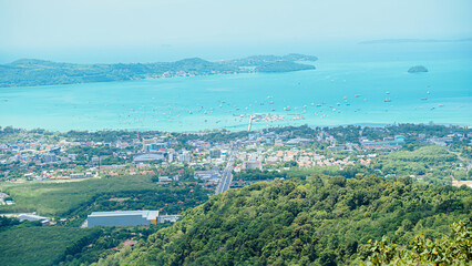 Phuket Big Buddha statue. afternoon light sky and blue ocean are on the back of white Phuket big Buddha is the one of landmarks on Phuket island Thailand.