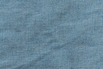 Texture of blue denim fabric. Textile. Jeans. Fashion
