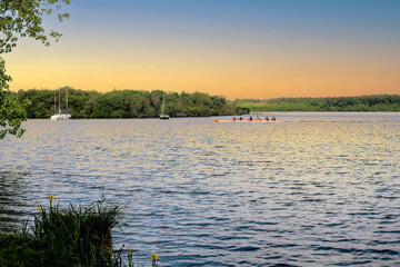 Group of men practicing paddling a canoe in Soustons