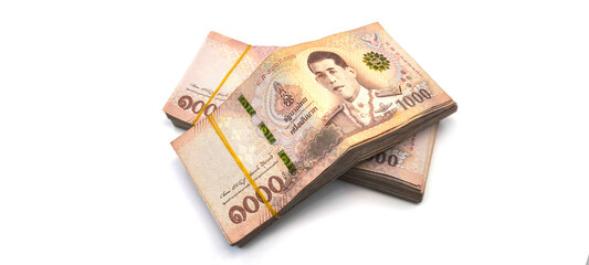 1.000 baht banknotes stacked on a white background. Finance and currency concept. Exchange rate.