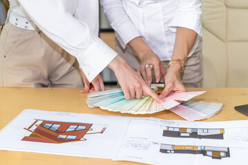 Hands of Professionals Examining Color Samples for Architectural Concept
