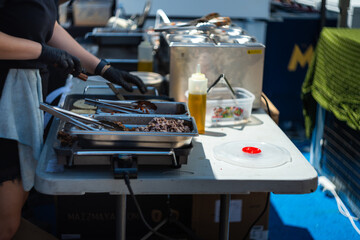 Preparing Food at an Outdoor Food Stall