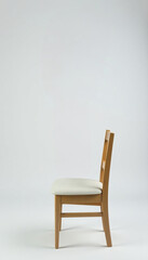 A single green balloon tied to a chair with a silver ribbon isolated on white , green balloon, silver ribbon, party