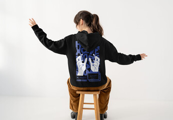 Mockup Of Woman Wearing Customized Hoodie On Stool
