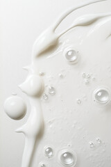 Close-up of creamy white sauce with bubbles, perfect for highlighting texture and fluidity in culinary presentations.