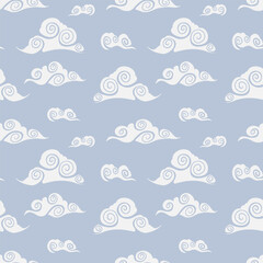 Clouds seamless pattern in asian style. Vector hand drawn seamless sky ornament. White chinese clouds on blue background. Print for wallpaper, wrapping, textile