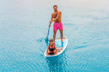 Photo from Hurghada in Egypt Father with sons on paddleboard