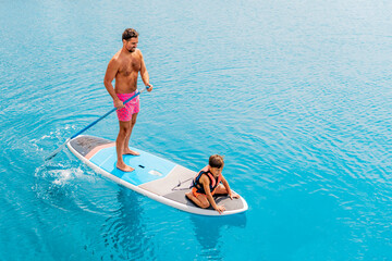 Photo from Hurghada in Egypt Father with sons on paddleboard