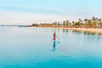 Photo from Hurghada in Egypt Father with sons on paddleboard