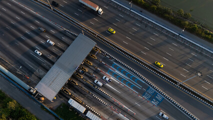 A highway where cars are paying tolls.