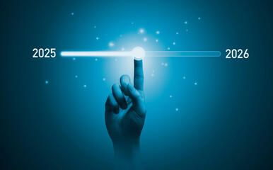 Hand touching on download bar status to change from 2025 to 2026 for countdown of merry Christmas and happy new year by technology concept, Start new business and new life.
