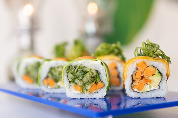 Brightly coloured plates with fresh sushi 