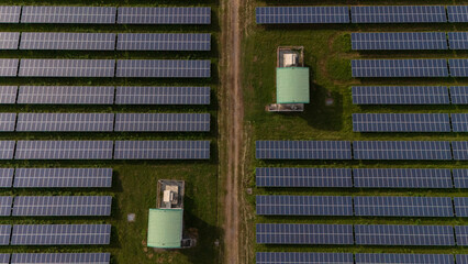 An aerial view of a solar power plant, also known as a solar park, is a large-scale photovoltaic (PV) system designed to supply commercial electricity to the grid.