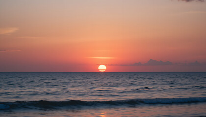 Title: Golden Sunset Over Tranquil Ocean with Gentle Waves and Vibrant Reflections