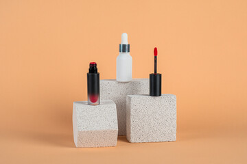 Mockup of black blank thin tube - mascara, lip gloss, gel, eyeliner, oil, etc. Cosmetic package with stylish props on cream background.