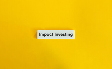 Impact Investing Phrase on Letter Tile on Yellow Background – Minimalist Concept for Sustainable Finance and Social Investment