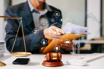 Lawyer or judge working with paperwork on his desk in office. Law and Legal services concept.