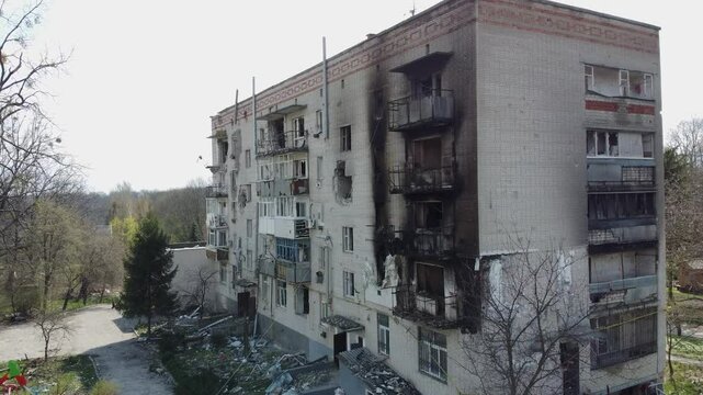 Consequences of a house explosion
after a missile strike. Missile strike. Burnt building, Rocket explosion.