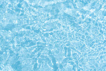Blue water with ripples on the surface. Defocus blurred transparent blue colored clear calm water...