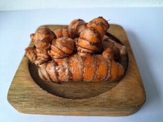 Turmeric rhizome. It's a traditional herbal plant in Indonesia that has many health benefits. Turmeric is often used in traditional medicine and also in cooking as a flavoring and natural coloring