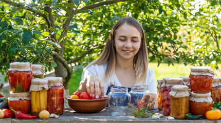 Woman Preserving Tomatoes and Vegetables in Garden