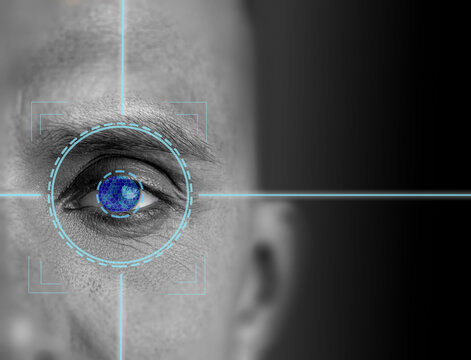 Close up view of human eye with digital targeting crosshair overlay showcasing biometric technology