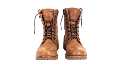 A pair of old, brown leather boots isolated on a white background