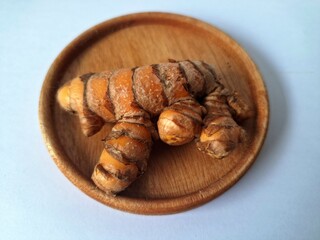 Turmeric rhizome. It's a traditional herbal plant in Indonesia that has many health benefits. Turmeric is often used in traditional medicine and also in cooking as a flavoring and natural coloring