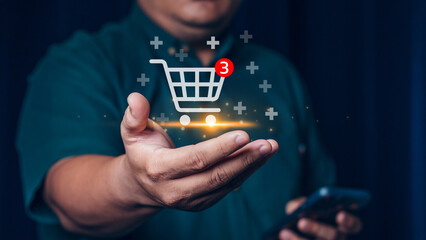 Young man using smartphone with shopping cart icon, Online shopping and e-commerce concept.
