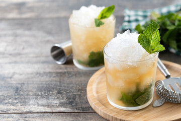 Classic Mint Julep Cocktail on wooden table. Copy space
