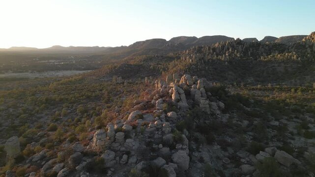 Golden hour view over rocky valley landscape in Creel, Valle de los Monjes, Mexico