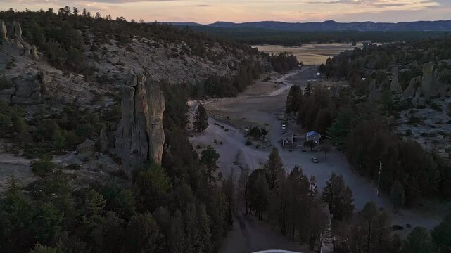 Majestic rock formations in Creel&rsquo;s Valle de los Monjes at dusk, serene mountain view