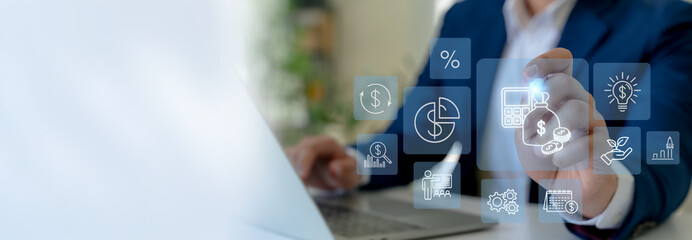 2026 budget and financial management concept. Business professional interacts the futuristic financial icons on virtual screen with budget planning, financial forecasting, efficient budget allocation.