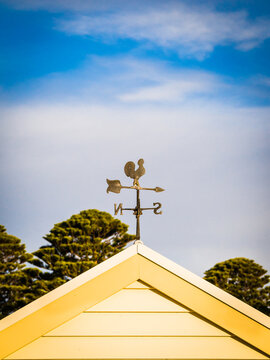 Weathervane on a gable roof.