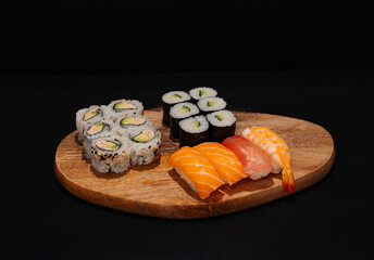 Creative minimalist display of assorted sushi rolls on a wooden platter against a dark backdrop, emphasizing vibrant colors and exquisite Japanese culinary art with a modern aesthetic.