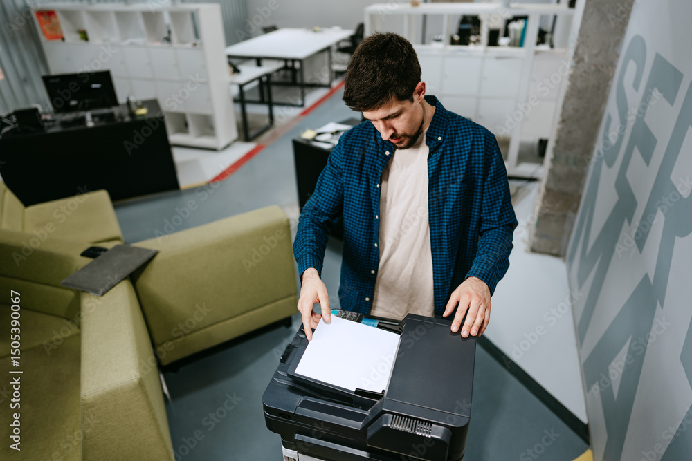 Poster office worker using a multifunction printer to scan documents in a modern workspace during the day