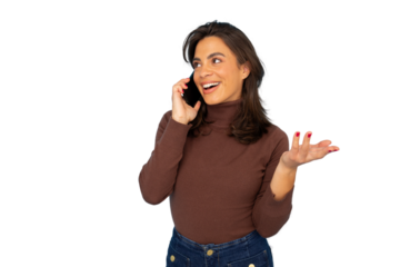 Young woman in turtleneck and jeans talking enthusiastically on smartphone, gesturing expressively against transparent background