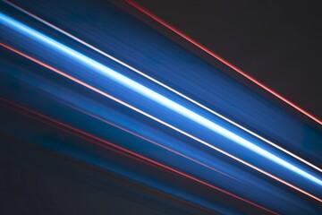 Fototapeta premium A photo of a dark background with dynamic, vibrant diagonal streaks of light