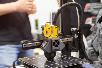 Modern 3D printer printing plastic product