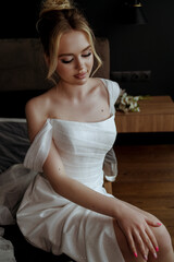 Fototapeta premium Beautiful bride Fashion portrait in wedding luxury dress with lace and crystals in dark interior