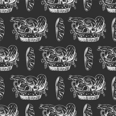 Hand drawn vintage seamless pattern of wicker basket filled with assorted bakery bread in engraving sketch style on chalkboard background