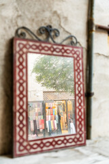 Reflection of Street market in vintage handmade mirror, Dubai Al Seef heritage market Street photography 