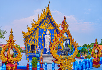 Viharn Hall with Buddha Statues and ornate sculptures, Blue Temple, Chiang Rai, Thailand