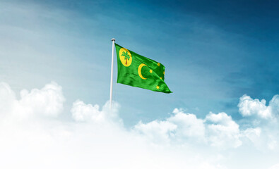 Cocos Islands national flag with mast waving in beautiful sky. Cocos Islands national flag for independence day.