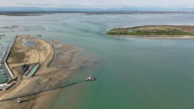 Hyper lapse of Mariano lagoon and spead boats near a Marinetta Island, Lignano Sabbiadoro, Italy