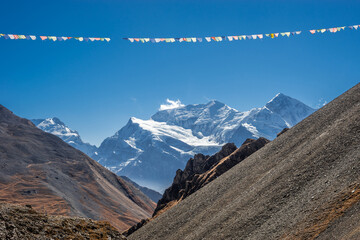 Gangapurna and Annapurna III summits with huge glaciers, view from Thorong high camp. Autumn sunny day in Himalaya mountains, Nepal.