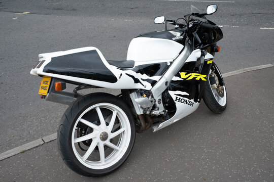 Ballymoney, Northern Ireland - May 24th, 2025: Black white Honda VFR motorcycle parked outside, no people