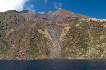 View from a boat to the Stromboli volcano on Stromboli island in the Tyrrhenian Sea. Aeolian (Lipari) Islands. Italy. Europe.