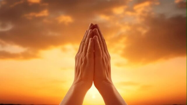 man praying and praising god with sunlight